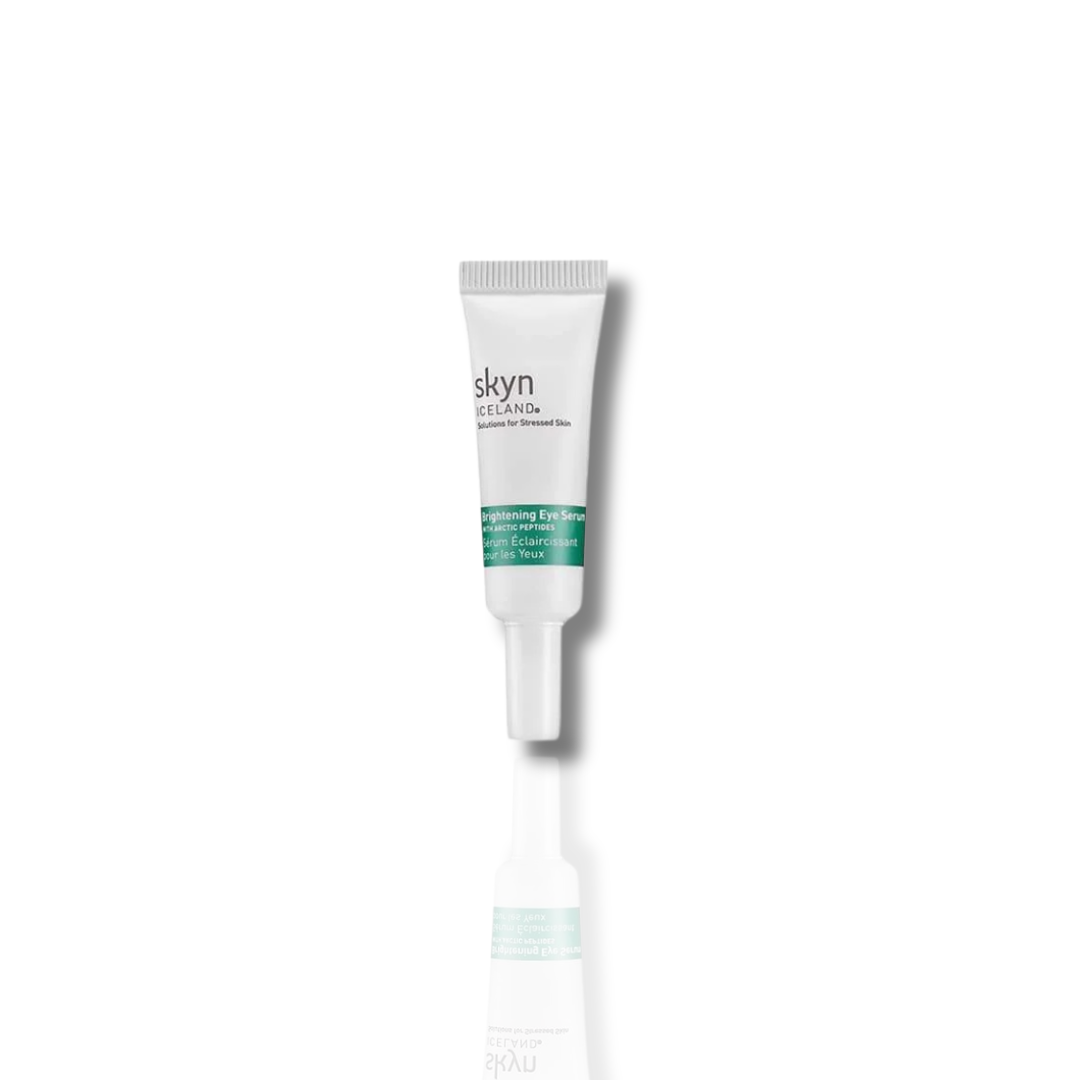 Small white tube of Brightening Eye Serum with green and black text and pointed applicator tip on white background.