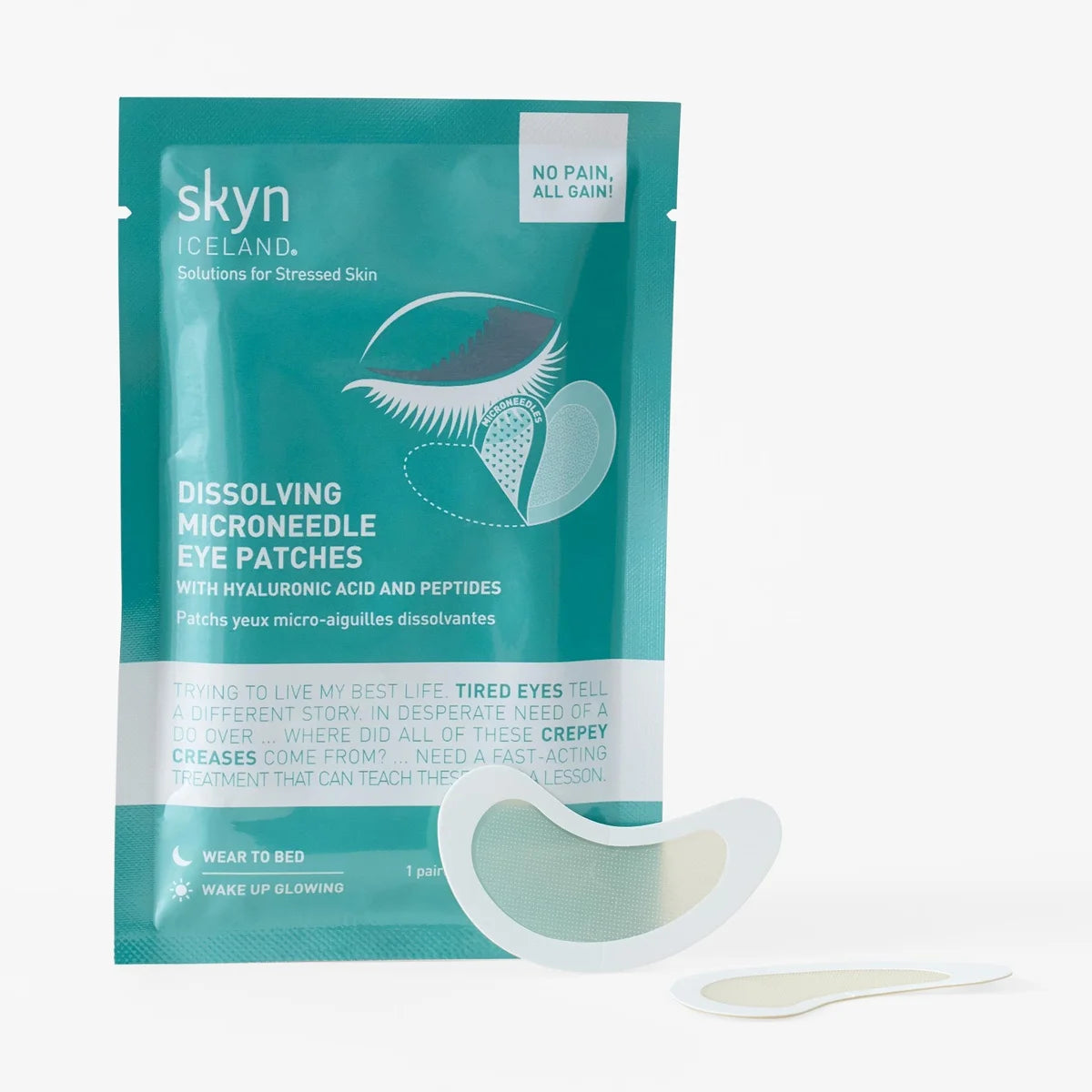 Teal and white packet labeled skyn Iceland Dissolving Microneedle Eye Patches with two curved white hydrogel eye patches.