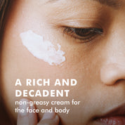 Close-up of a person’s cheek with white Arctic Repair Cream applied in a smooth streak.