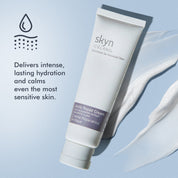White tube of skyn Iceland Arctic Repair Cream with soft cream smear on light blue background.