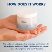 Hand holding Nordic Skin Peel jar with white lid and blue label detailing chemical exfoliation ingredients.