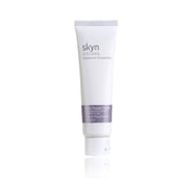 White tube of skyn Iceland Arctic Repair Cream with purple label and white cap on reflective surface.