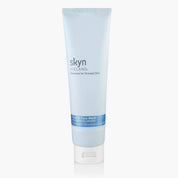White tube of Skyn Iceland Glacial Face Wash with blue and black text and white flip cap.