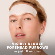Woman wearing a white hydro cool firming gel patch on her forehead against light background.