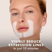 Woman wearing white hydro cool firming face gels along smile lines on cheeks.