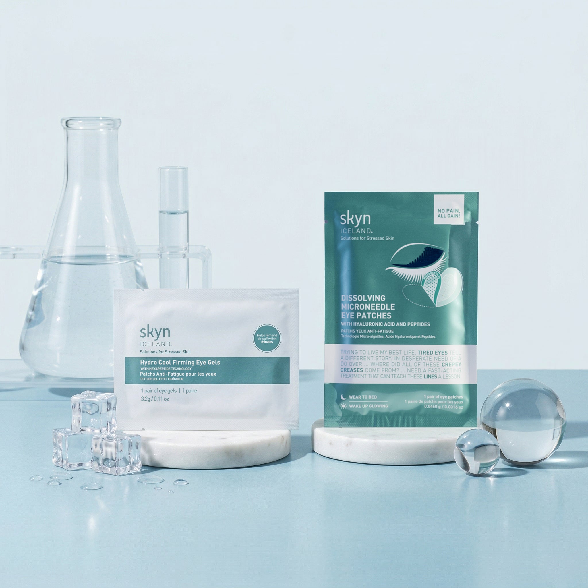 Skyn Iceland 24-Hour Eye Rescue Duo with cooling eye gels and dark circle patches in teal packaging on white display stands.