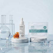 Skyn ICELAND Morning Eye Refresh Duo with white serum bottle and blue eye gel packet on marble stands with glass beakers and .